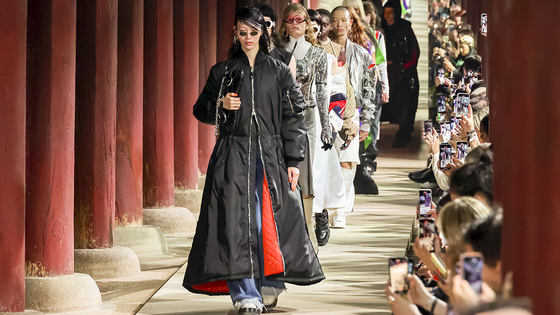 Models walk down Geunjeongjeon's haenggak, a roofed corridor, for the latest Gucci Cruise 2024 collection show on May 16. [GUCCI]