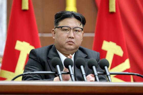 In this photo released by the North's Korean Central News Agency on Sunday, leader Kim Jong-un attends the plenary session of the ruling Workers' Party Central Committee on Saturday in Pyongyang. [NEWS1]