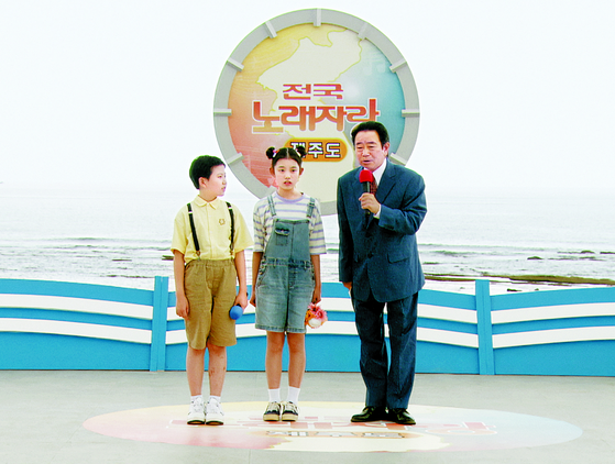 The opening scene from the JTBC drama ″Welcome to Samdal-ri,″ featuring a deepfake rendition of the late broadcaster Song Hae [JTBC]