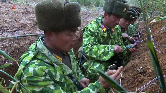 North Korea's Korean Central TV shows a 44-second video of North Korean soldiers detonating explosives on Saturday. Kim Yo-jong, the sister of North Korean leader Kim Jong-un, released a statement on Sunday claiming that the South Korean military mistook the explosives for artillery shells. [KOREAN CENTRAL TV/ YONHAP]