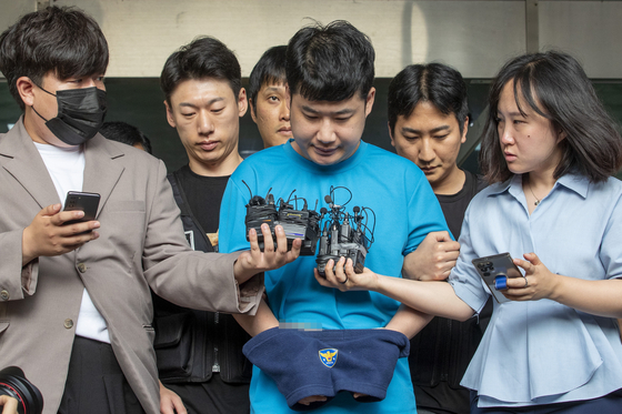 Jo Seon, who went on a stabling rampage on July 21,being escorted to the prosecutors’ office by the Gwanak District police on July 28. [JOINT PRESS CORPS] 
