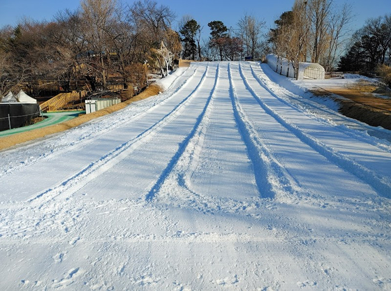 SLP Children's Center transforms the outdoor swimming pool area into a sledding zone every winter. [SLP CHILDREN'S CENTER]