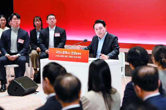 President Yoon Suk Yeol speaks in a policy debate involving the government and members of the public at the Korea Exchange in western Seoul on Wednesday. [YONHAP]