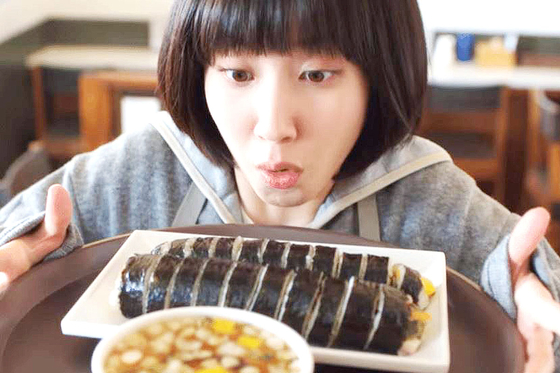 Woo Young-woo holds a tray with gimbap in a poster for “Extraordinary Attorney Woo” (2022). [ENA, JOONGANG PHOTO]
