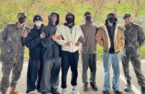 All members of BTS are currently completing their mandatory military service. This picture was taken on Dec. 11 when BTS's Jimin and Jungkook enlisted. [SCREEN CAPTURE]