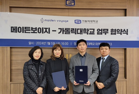 Representatives of Maiden Voyage and The Catholic University of Korea's Korean Language Education Center pose for a photo after signing a memorandum of understanding. [MAIDEN VOYAGE]