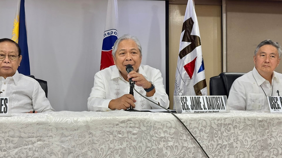 Secretary of Transportation of the Philippines Jaime J. Bautista, center, awards the SMC-SAP Company Consortium for the NAIA Public-Private Partnership Project on Friday. The project is expected to improve the passenger experience at the airport, achieve more efficient operations and expand airport capacity. [DEPARTMENT OF TRANSPORTATION PHILIPPINES]