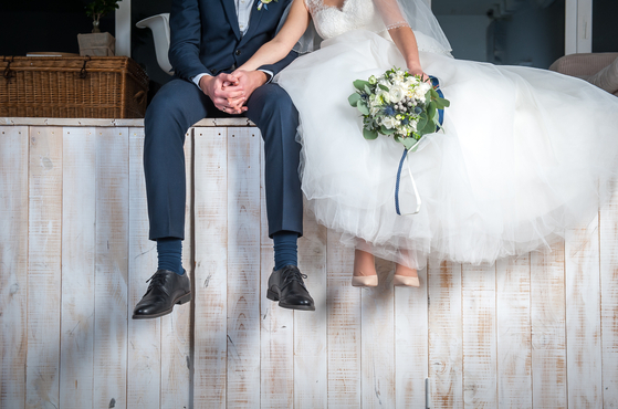 An image of a wedding couple [SHUTTERSTOCK]