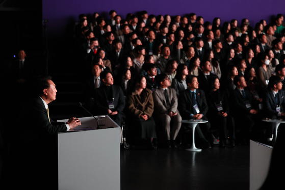 President Yoon Suk Yeol, left, speaks at the 17th public livelihood debate on youth policies at Ivex Studio in Gwangmyeong, Gyeonggi, on Tuesday. [JOINT PRESS CORPS]