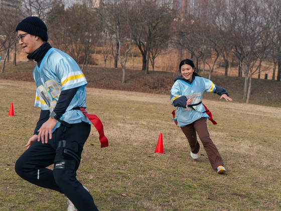 Mary chases her partner around the cones in a drill akin to a familiar children's game. But this is no child's play. [GENF]