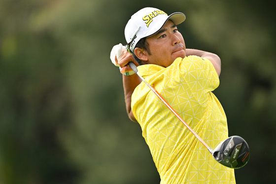 Hideki Matsuyama of Japan tees off on the 17th hole during the final round of The Genesis Invitational at Riviera Country Club on Feb. 18 in Pacific Palisades, California. [GETTY IMAGES]