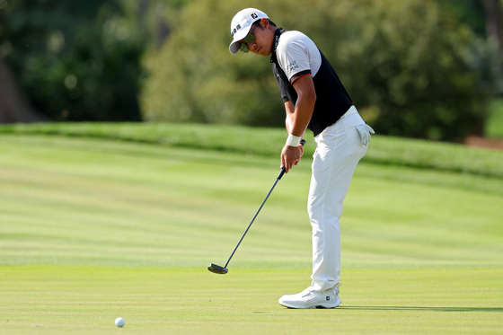 C.T. Pan putts on the seventh green during the second round of The Players Championship on the Stadium Course at TPC Sawgrass in Ponte Vedra Beach, Florida on Friday.  [GETTY IMAGES]