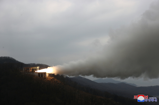 North Korea conducts a ground jet test of a solid-fuel engine for a new type of intermediate-range hypersonic missile at the Sohae Satellite Launching Ground on Tuesday. [YONHAP]