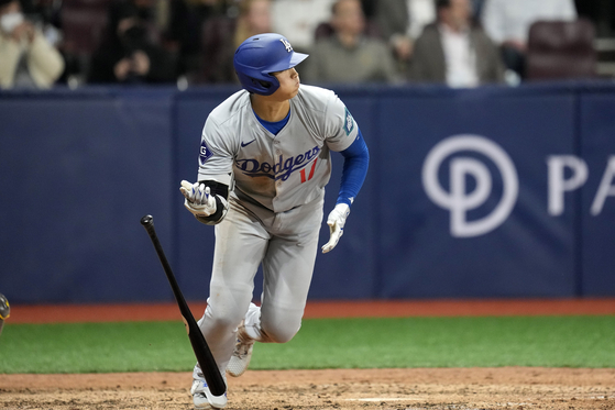 Los Angeles Dodgers designated hitter Shohei Ohtani heads to first for an RBI single during the eighth inning of an opening day game against the San Diego Padres at Gocheok Sky Dome in western Seoul on Wednesday.  [AP/YONHAP]