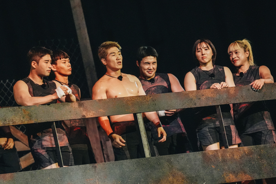 Lee Won-hee, third from left, stands with a group of fellow "Physical: 100" contestants. [NETFLIX]