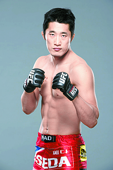 Welterweight Kim Dong-hyun poses for a portrait during a UFC photo session inside the MGM Grand Garden Arena on May 21, 2015 in Las Vegas, Nevada. [GETTY IMAGES]