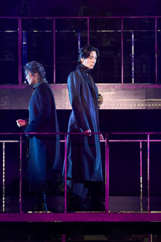A scene featuring Jogak, left, and Tuu in the ongoing musical "Pagwa" at Hongik Daehangno Art Center in Jongno District, central Seoul. [PAGE1]