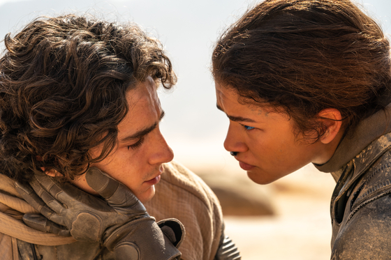 A scene from "Dune: Part Two," starring Timothee Chalamet as Paul Atreides, left, and Zendaya as Chani [WARNER BROS. KOREA]