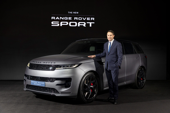 Robin Colgan, managing director of Jaguar Land Rover Korea, poses with the latest Range Rover Sport SUV. [JAGUAR LAND ROVER KOREA]