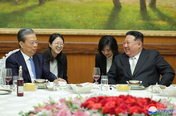 North Korean leader Kim Jong-un, right, meets with Zhao Leji, chairman of the Standing Committee of the National People's Congress of China, in Pyongyang on Saturday. [YONHAP]