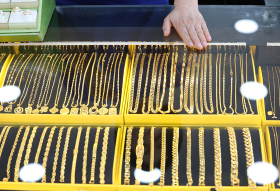 Gold prices broke $2,400 an ounce for the first time on Friday as tensions escalate in the Middle East. [YONHAP] 