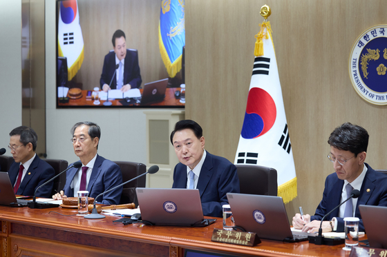 President Yoon Suk Yeol, center, speaks on the results of last week's general election for the first time during a Cabinet meeting at the Yongsan presidential office in central Seoul on Tuesday. [PRESIDENTIAL OFFICE] 