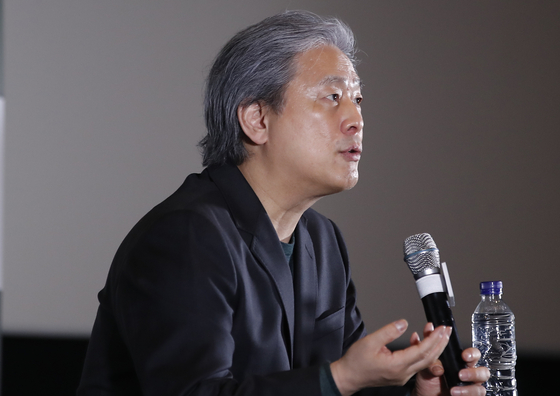 Director Park Chan-wook answers questions from reporters following a screening of two episodes of his latest historical black comedy series ″The Sympathizer″ at Megabox COEX in southern Seoul on Thursday. ″The Sympathizer″ is available for streaming in Korea exclusively on Coupang Play. New episodes are uploaded every Monday. [NEWS1]