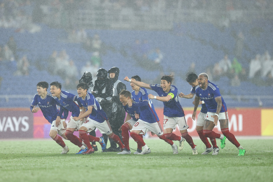 The Yokohama F. Marinos celebrate after winning a penalty shoot-out against Ulsan HD during the second leg of the 2023-24 AFC Champions League semifinals at the International Stadium Yokohama in Japan on Wednesday. [AFC]