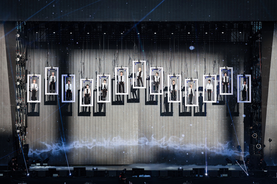 Seventeen performs at the boy band's ″'Follow Again' in Seoul' encore concert held Saturday at the Seoul World Cup Stadium in Mapo District, western Seoul. [PLEDIS ENTERTAINMENT]