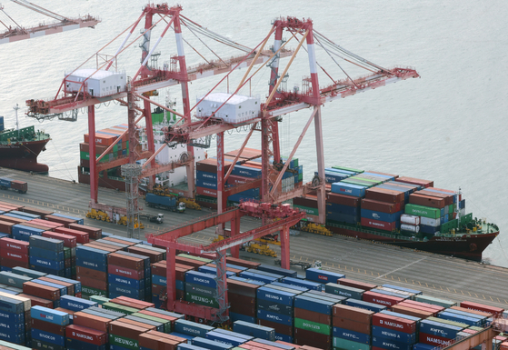 Containers for exports are stacked at a pier in the southeastern port city of Busan in this file photo taken on Jan. 1, 2024. [YONHAP]
