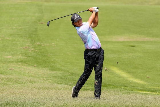 Kim Seong-hyeon hits an approach shot on the ninth hole during the second round of The CJ Cup Byron Nelson on Friday at at TPC Craig Ranch in McKinney, Texas.  [GETTY IMAGES]