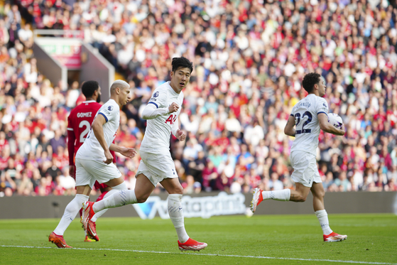 Tottenham's Son Heung-min, center, celebrates scoring his side's second goal during the match between Liverpool and Tottenham Hotspur at Anfield in Liverpool, England on Sunday. [AP/YONHAP]