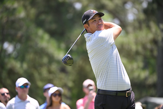 An Byeong-hun hits a drive on the third tee box during the final round of the Wells Fargo Championship at Quail Hollow Club in Charlotte, North Carolina on Sunday.  [GETTY IMAGES]