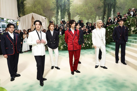 Stray Kids poses for photographers at this year's Met Gala. [GETTY IMAGES]