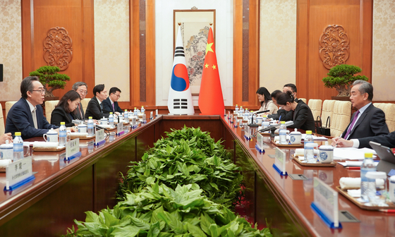 South Korean Foreign Minister Cho Tae-yul, far left, speaks during a meeting with his Chinese counterpart, Wang Yi, at the Diaoyutai State Guesthouse in Beijing on Monday evening. [JOINT PRESS CORPS] 