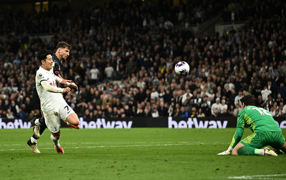 Manchester City's Stefan Ortega, right, saves a shot by Tottenham Hotspur's Son Heung-min at Tottenham Hotspur Stadium in London, England on Tuesday. [REUTERS/YONHAP]