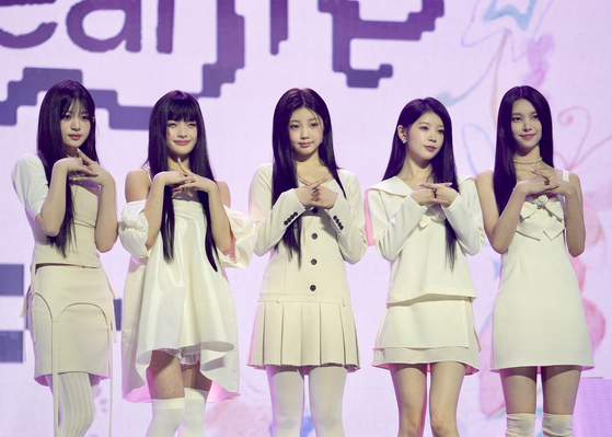 ILLIT, HYBE's newest girl group, poses for the camera during a showcase on Monday in central Seoul. [DANIELA GONZALEZ PEREZ]