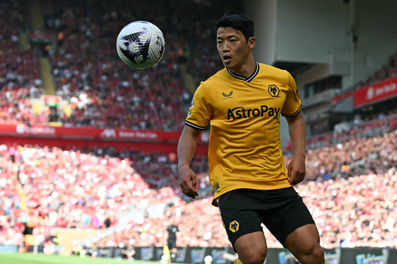Wolverhampton Wanderers forward Hwang Hee-chan eyes the ball during a Premier League match against Liverpool at Anfield in Liverpool, England on Sunday. [AFP/YONHAP] 