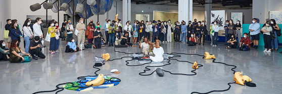 Nigerian-born visual artist Otobong Nkanga performs ″Soft Offerings″ (2022) during a preview event of the 2022 Busan Biennale at the Busan Museum of Contemporary Art on Sept. 2, 2022. [BUSAN BIENNALE]