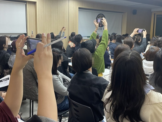 Dozens of parents of elementary and middle school students attend an information session hosted by a cram school running a preparatory course for medical school admissions in Daechi-dong, southern Seoul. The photo is provided by the cram school named Next Doc. [NEXT DOC]