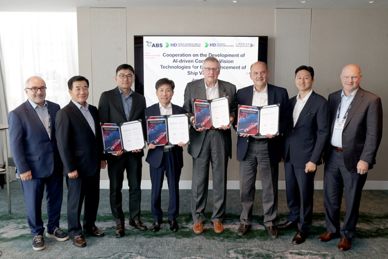 HD Hyundai's Vice Chairman Chung Ki-Sun, second from the right, poses for a photo at the signing of a memorandum of understanding with the American Ship Classification Association (ABS) and the Liberian Registry (LISCR) on the development of new ship structures at Posidonia 2024. [HD HYUNDAI]