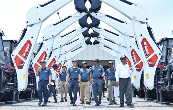 Doosan Bobcat Vice Chairman Scott Park, fourth from left, and President of Asia, Latin America and Oceania Park Hyung-won, third from left, visit the company's factory in Chennai, India. [DOOSAN BOBCAT]