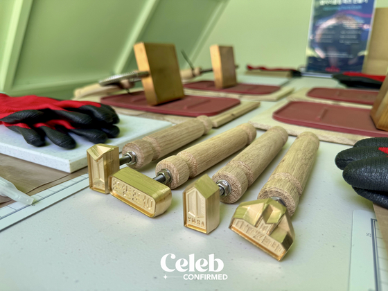 Stamps at BTS Festa 2024 featuring logos of the fandom, band, event and the phrase "ah-po-bang-po," which means ARMY forever, Bangtan forever. [DANIELA GONZALEZ PEREZ]