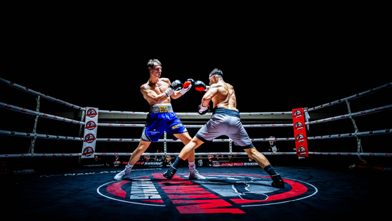 This image, titled ″The Dynamic Duo″ by photographer Andrew Moss, took gold in the Boxing category at the 2024 World Sports Photography Awards.  [ANDREW MOSS]
