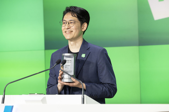 Webtoon Entertainment founder and CEO Kim Jun-koo poses for a photo at the bell-ringing ceremony of the company's Nasdaq listing at New York's Times Square on Thursday. [WEBTOON ENTERTAINMENT]