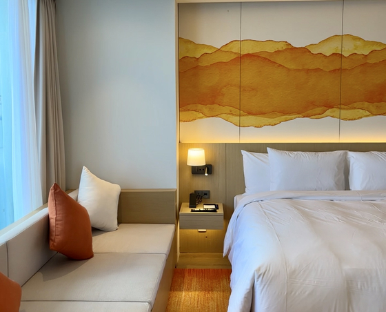 The bedroom of a suite at Cassia Sokcho [LEE JIAN]