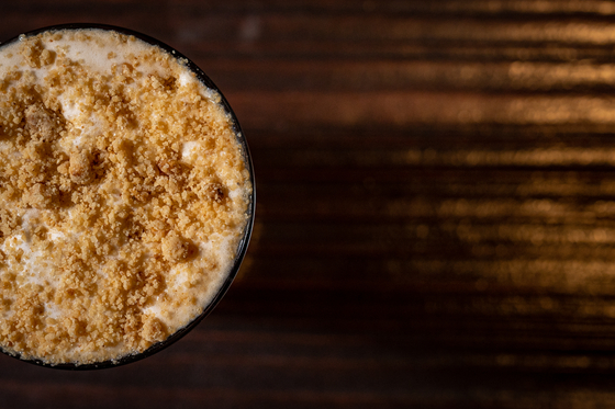 The biscuit einspanner is made with roasted tonka bean scotch with espresso, Italian Amarettto and upcycled coffee Amaro topped with salted cacao cream and biscuit crumble. [ZEST]