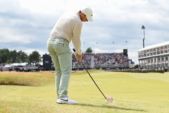 Rory McIlroy plays his second shot on the 18th hole during Day Four of the Genesis Scottish Open at The Renaissance Club on July 16, 2023 in the United Kingdom. [GETTY IMAGES]