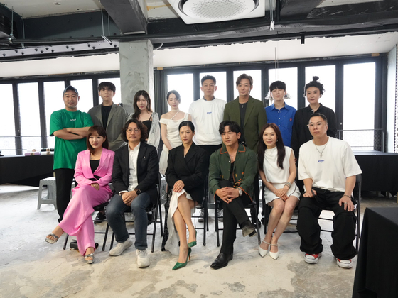 ″Artainers,″ or entertainers who double as artists, pose for photos during a press conference for their exhibition ″bbuck on & off″ held on July 3 in Itaewon, central Seoul. [ARTVERSE]