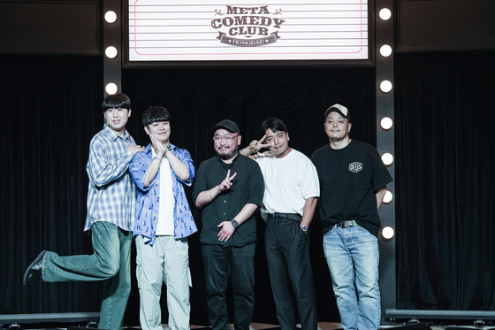 Comedians Lee Jae-yul, far left and Meta Comedy CEO Joon Chung, far right, pose with comedians Kim Dong-ha, second from left, Danny Cho, center, and Kwak Beom for the press on the July 15 at the Meta Comedy Club Hongdae in Hongdae, Mapo District, western Seoul. [META COMEDY]